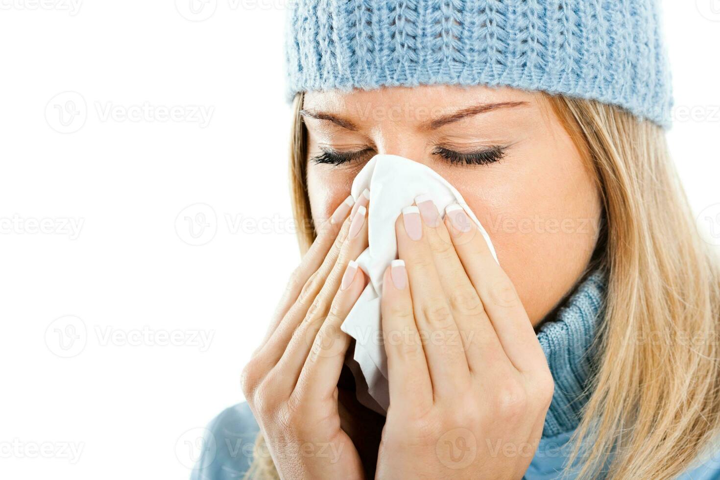 Woman blowing into tissue photo
