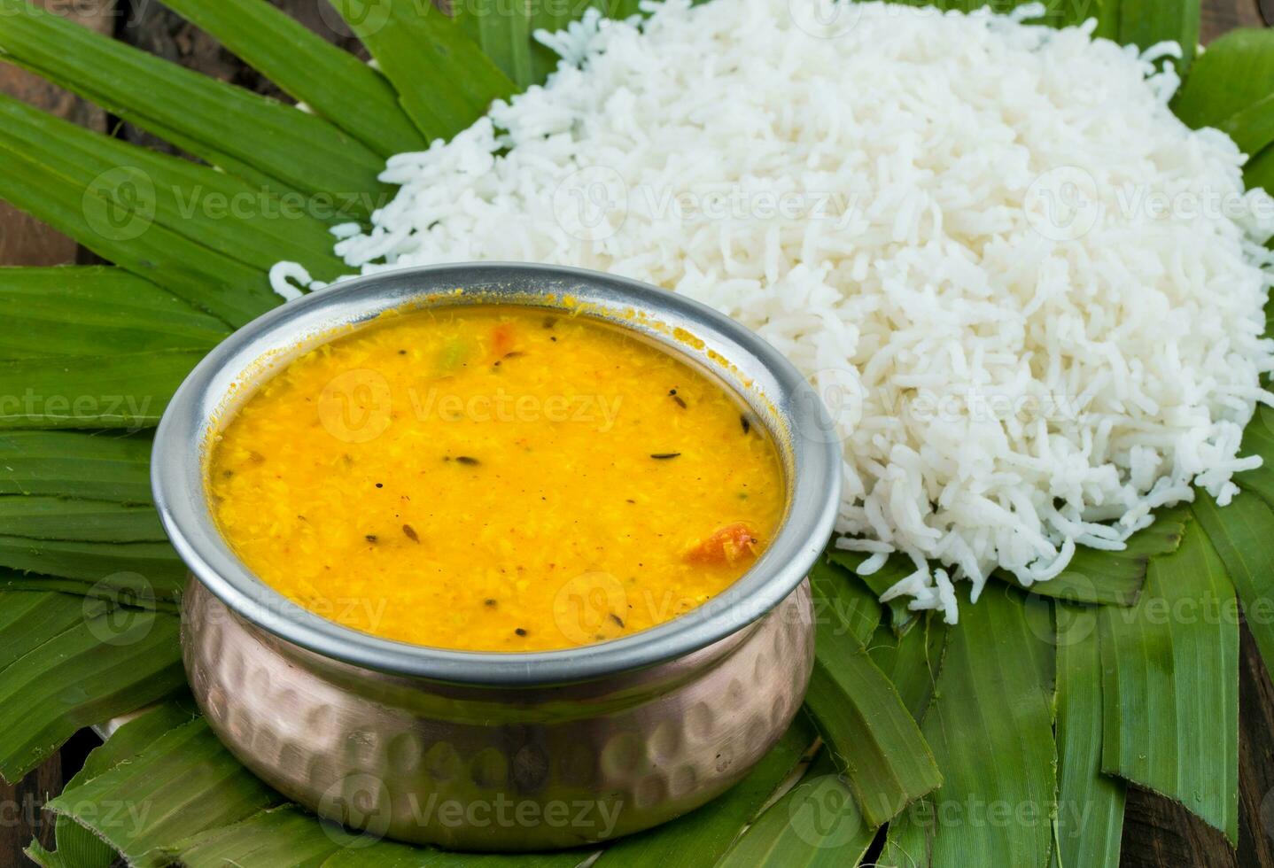 Indian Traditional Cuisine Dal Fry or Rice Also Know as Dal Chawal on Wooden Background photo