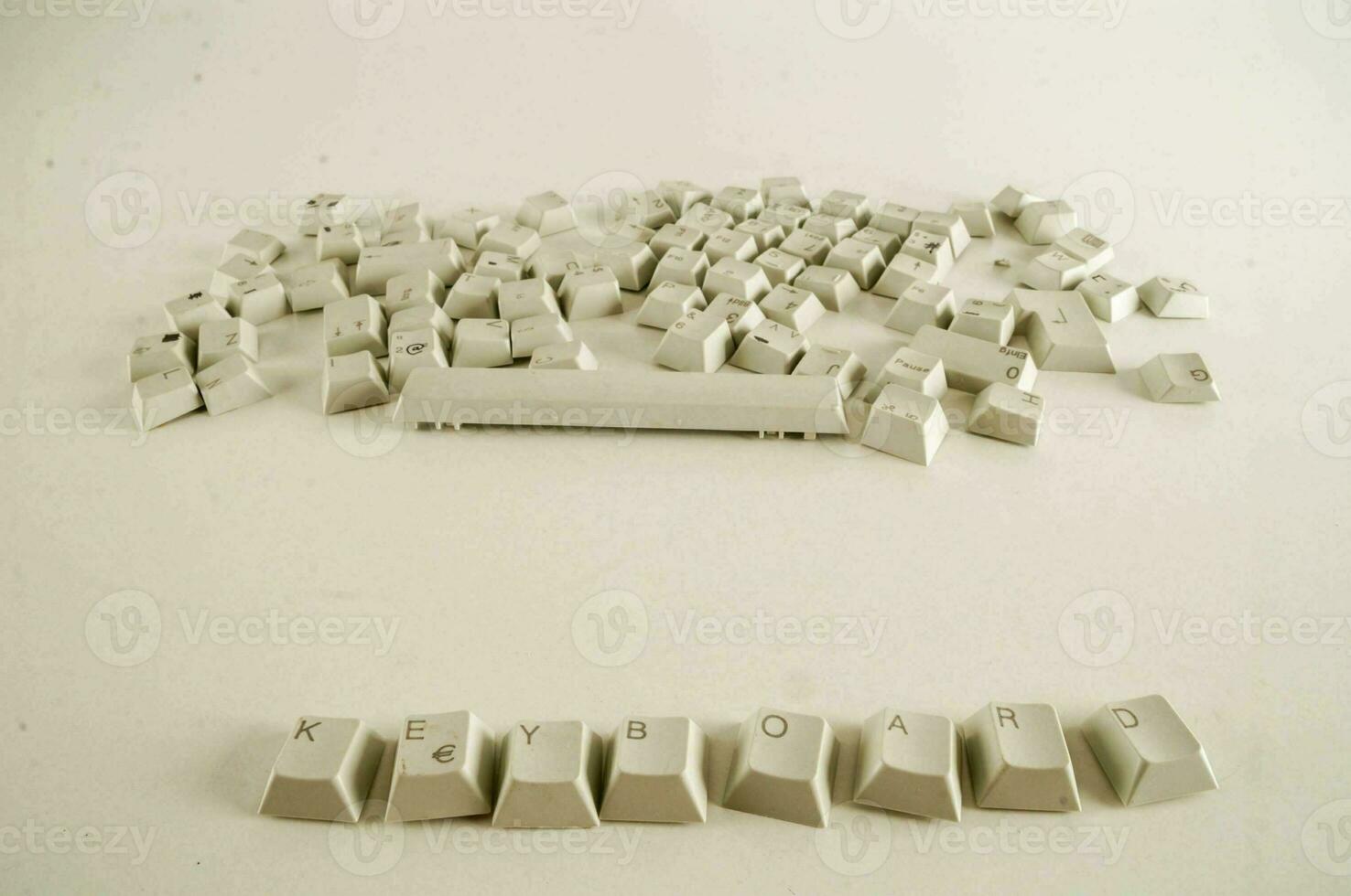 a pile of white computer keys photo