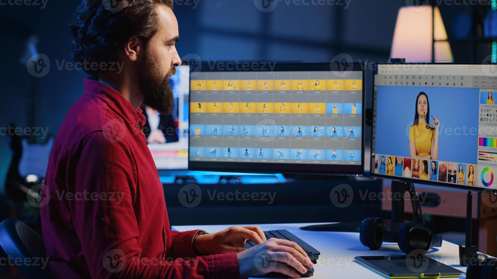 Happy photo editor retouching photographs with editing software on desktop computer, zooming in to find spots that need correcting. Focused photographer in creative workplace adjusting images