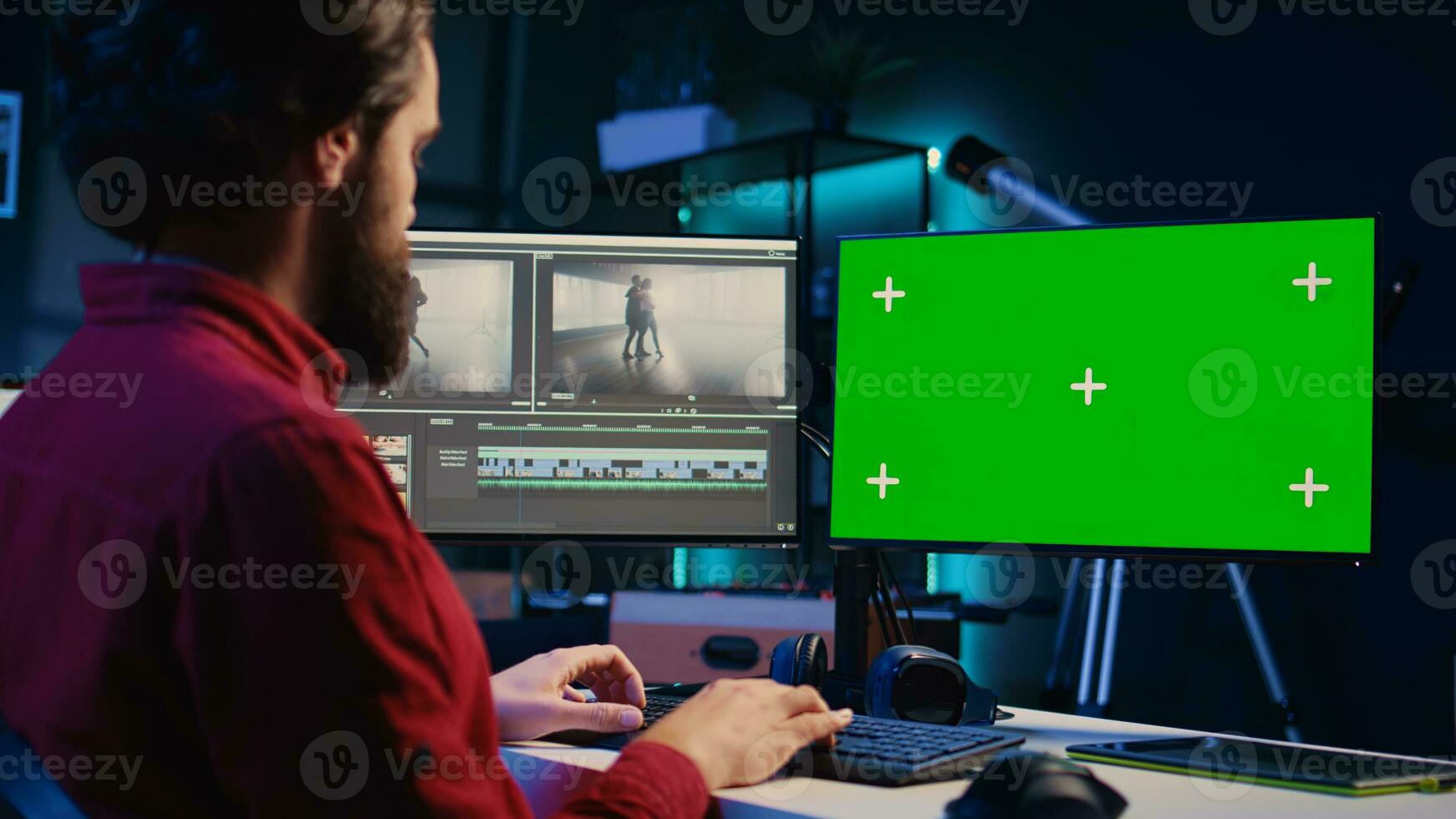 Video editor analyzing film montage on isolated screen display before editing color grading and lighting in creative office. Post production studio employee working with raw footage on chroma key PC photo