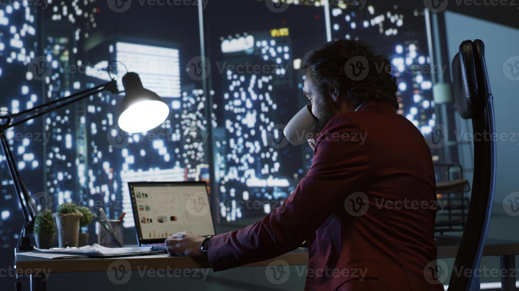 Company CEO thinking of ways to develop business globally, admiring city center view from his modern office building. Successful director analyzes monthly profit for development. photo