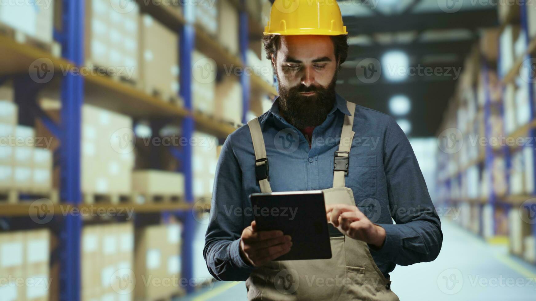 Storage room advisor counting packs of industrial items, checking depot stock on racks inside warehouse. Distribution operations officer doing quality control for retail, store products in bulk. photo