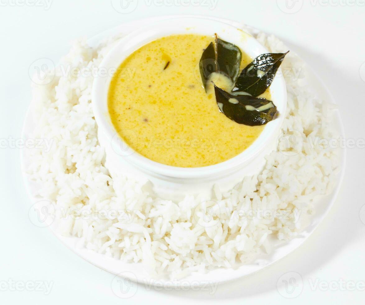 Indian Traditional Cuisine Kadhi Chawal Also Know as Curry Chawal, Yogurt Curry with Rice on White Background photo
