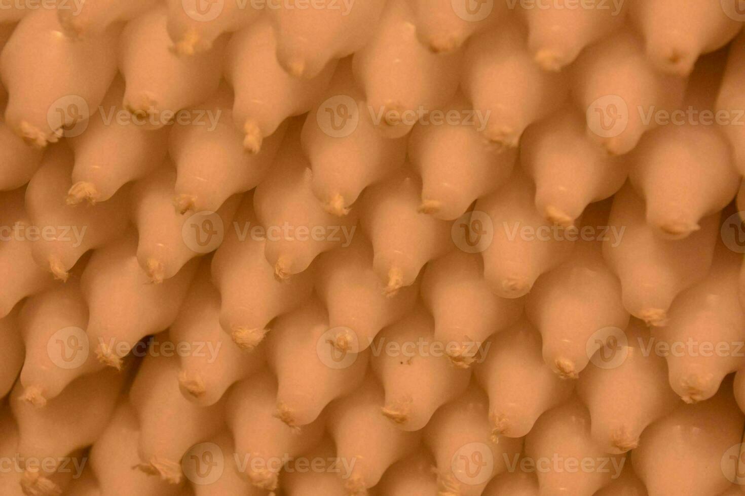 a stack of white candles photo