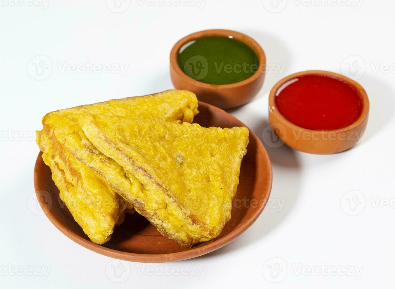 Indian Fried Snack Bread Pakora or Bread Bhaji Served with Tomato Ketchup, Green Chutney it is Made From Bread Slices photo