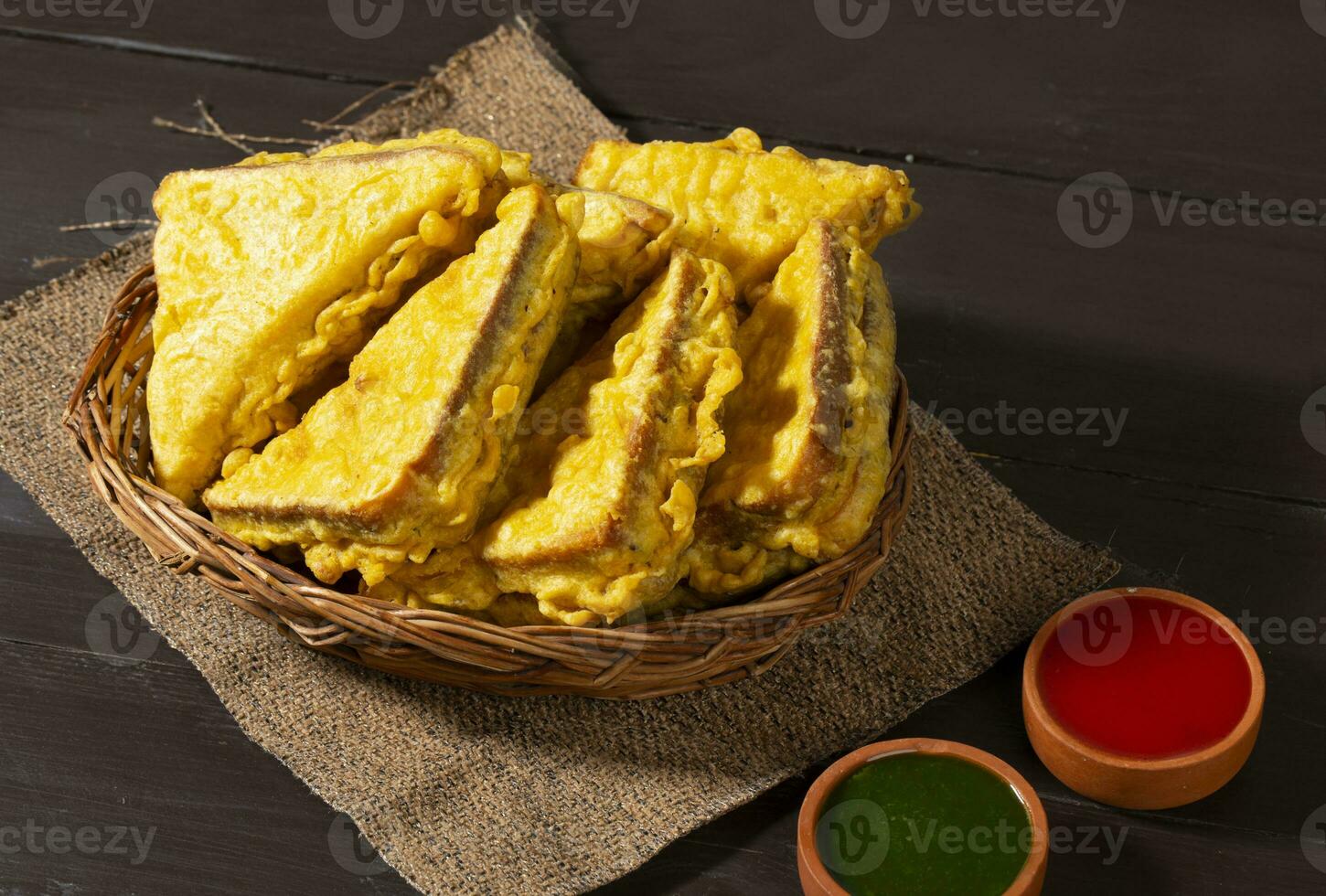 Indian Fried Snack Bread Pakora or Bread Bhaji Served with Tomato Ketchup, Green Chutney it is Made From Bread Slices photo