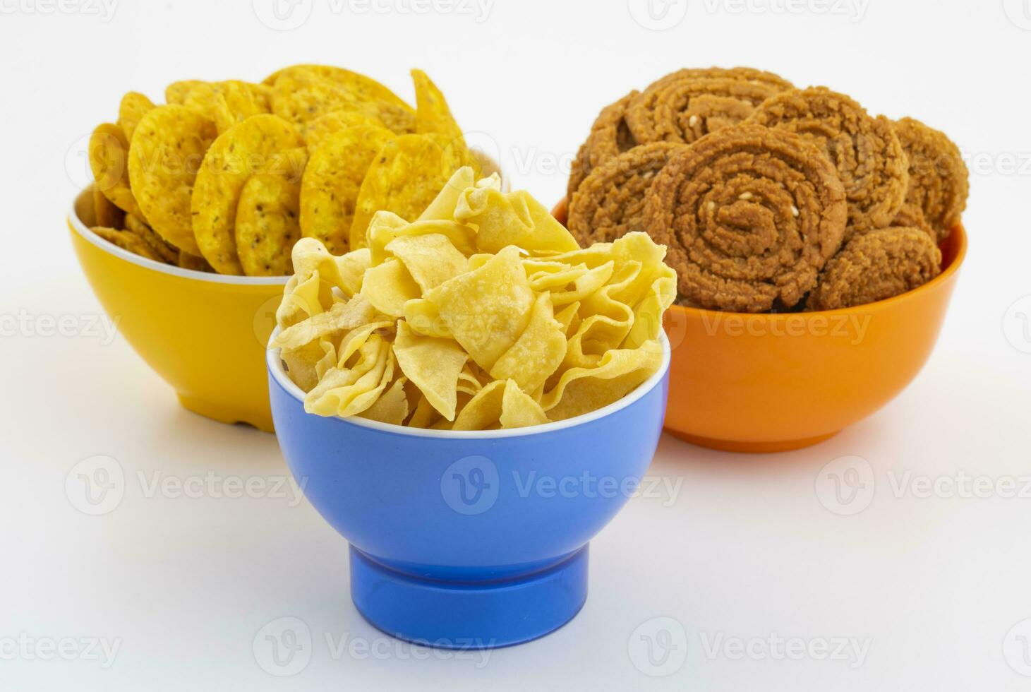 Indian Street Snack Food Besan Papdi With Masala Khari Papdi or Chakli on White Background photo