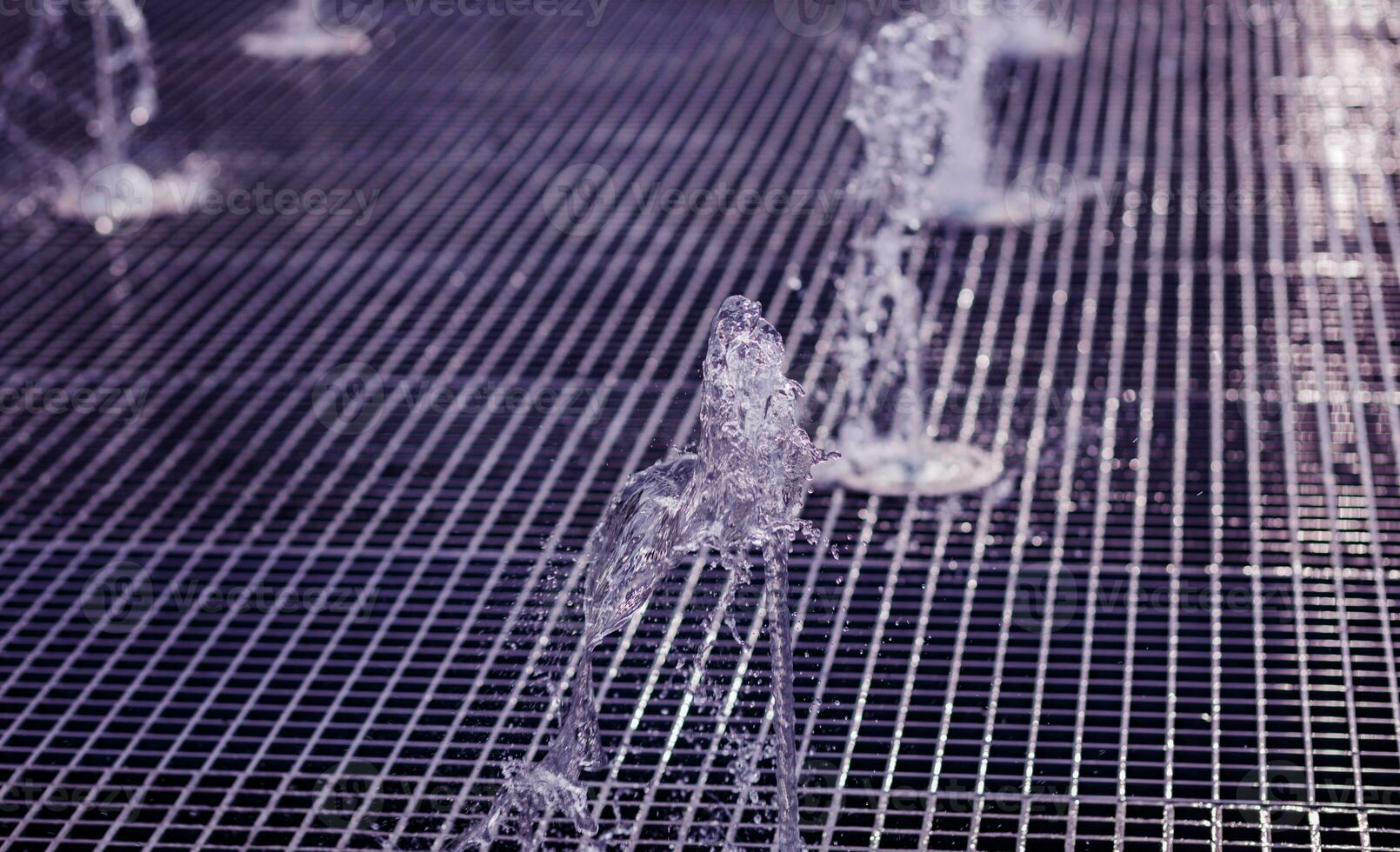 Splash of water in the fountain. photo