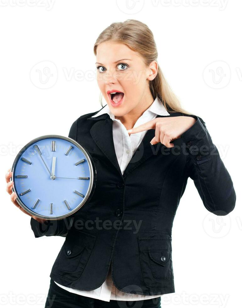 Businesswoman pointing at clock photo