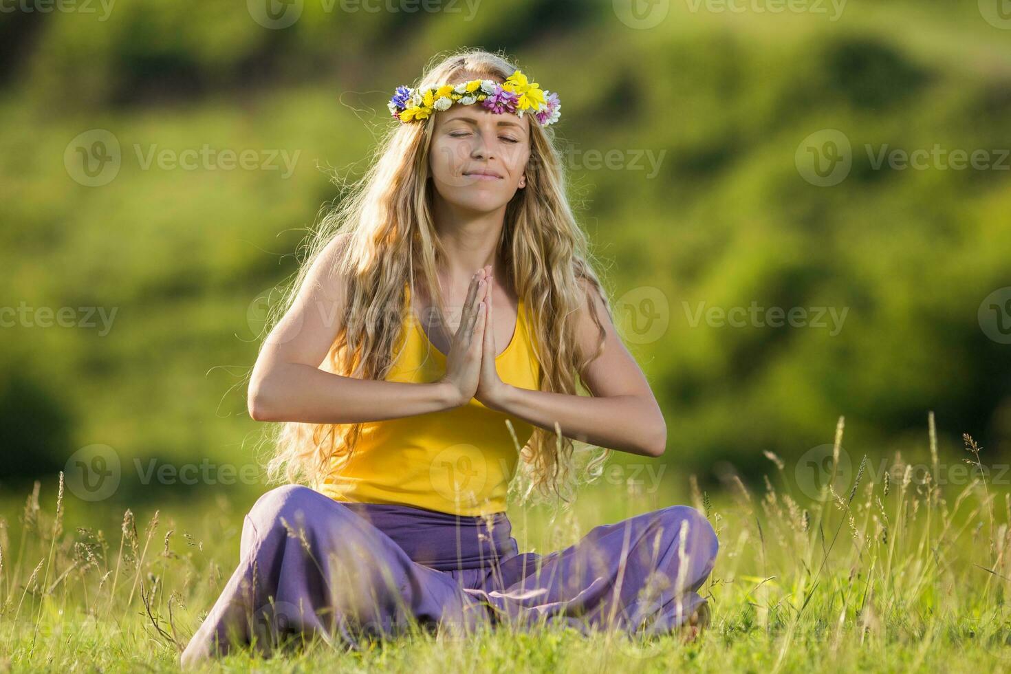 Woman meditating in nature photo