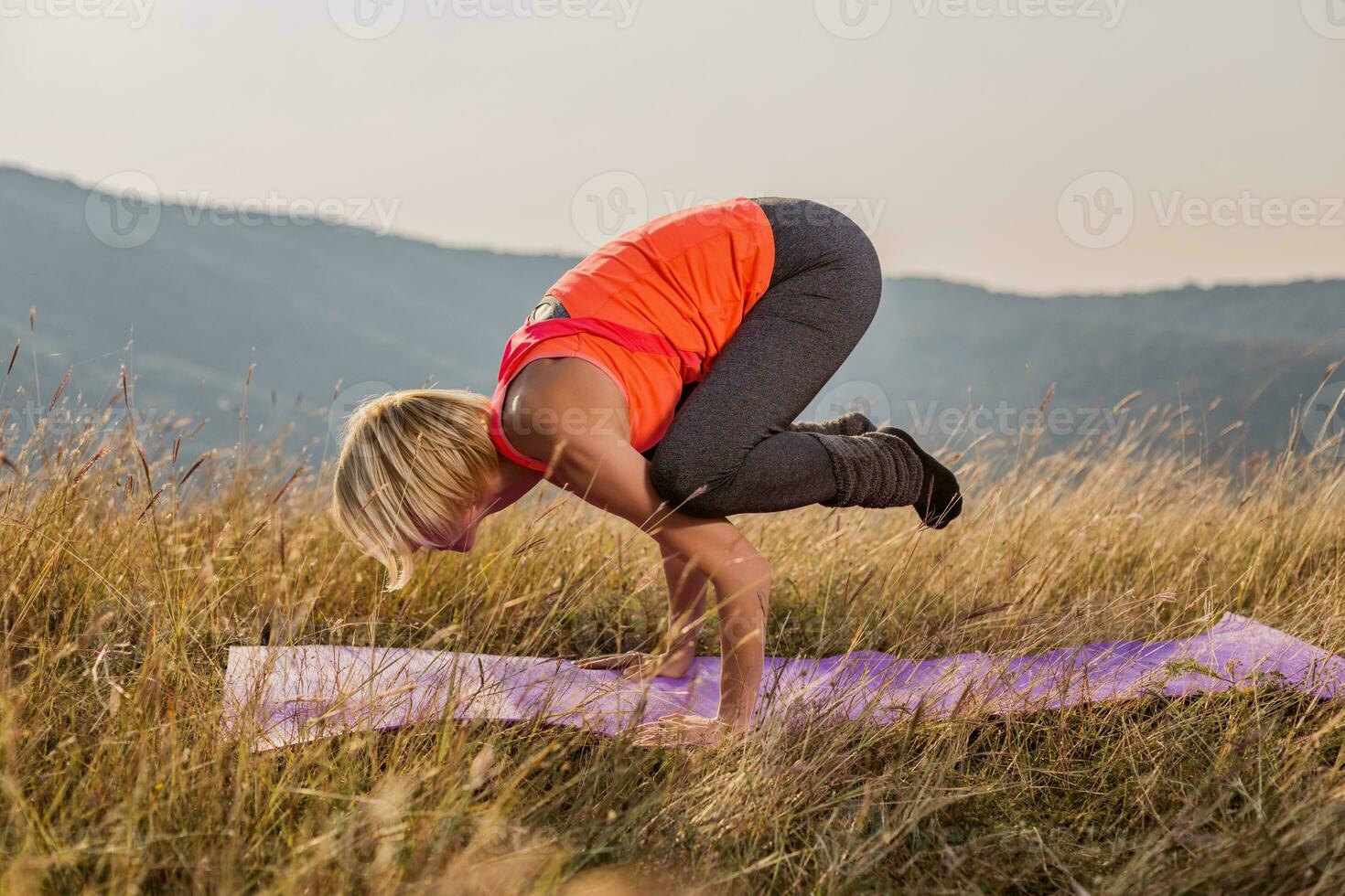 Beautiful woman doing yoga in the nature photo