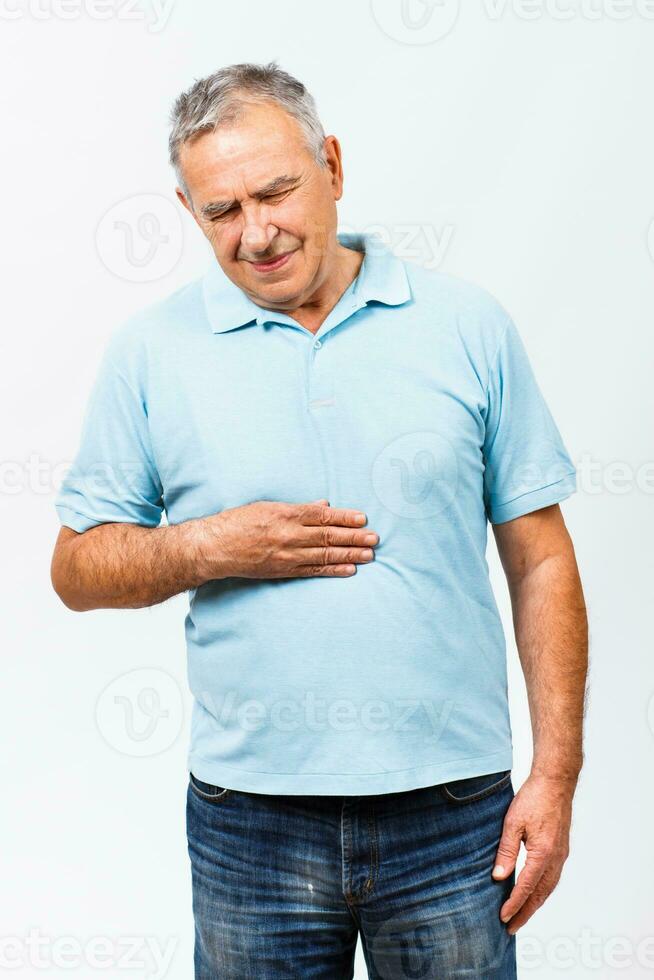 Senior man having stomachache photo