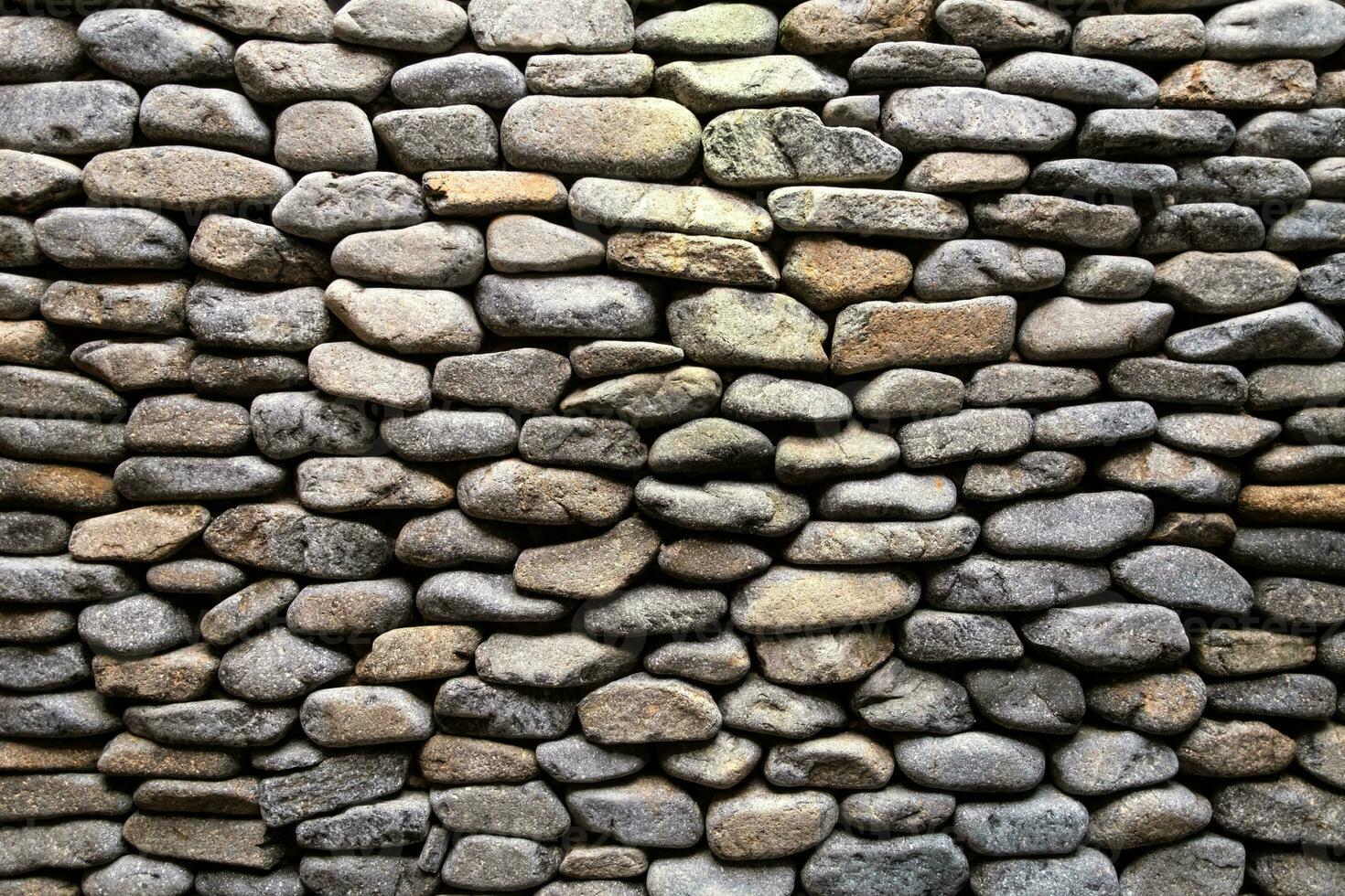 Decorative stone wall surface. Textured background. photo