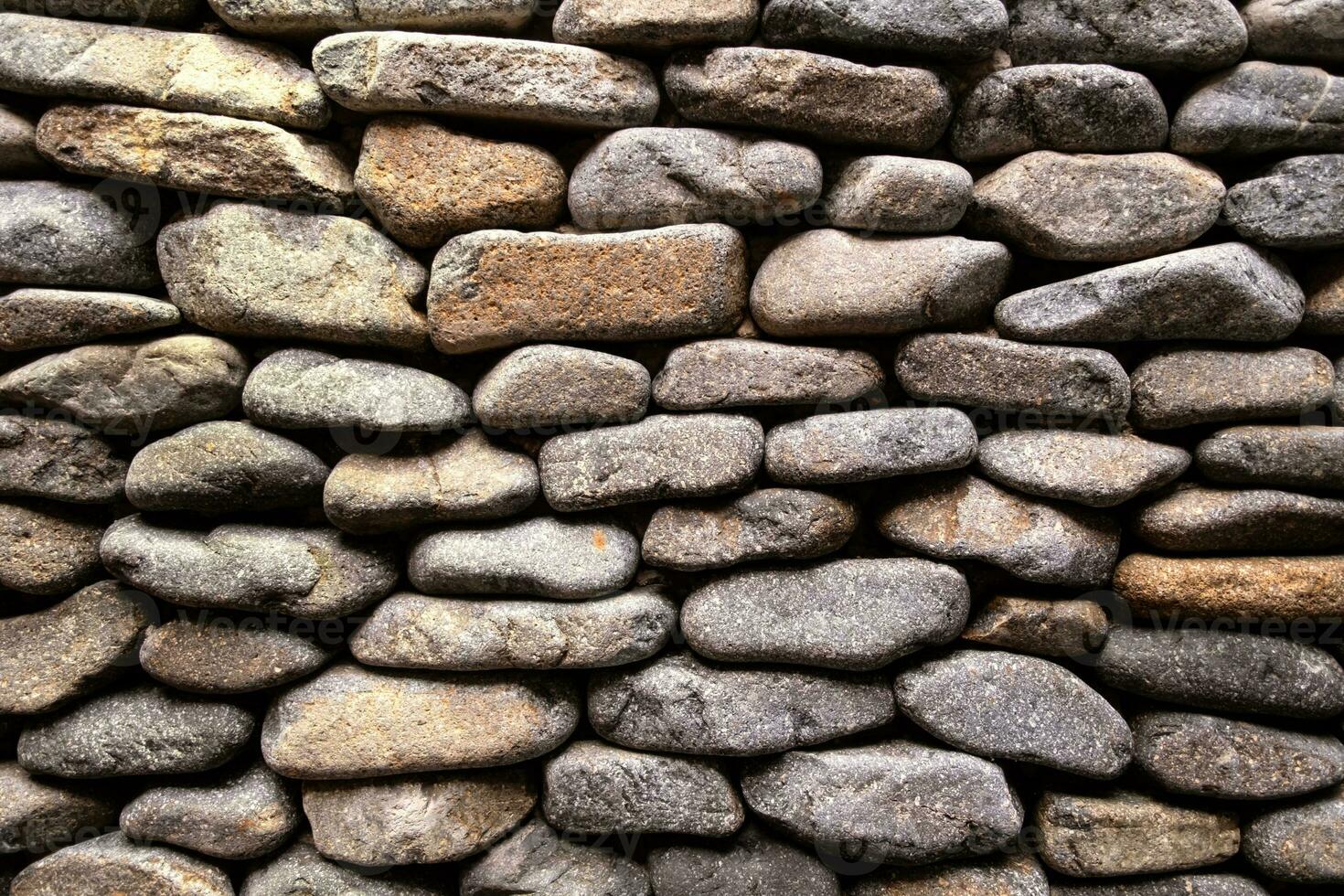 Decorative stone wall surface. Textured background. photo