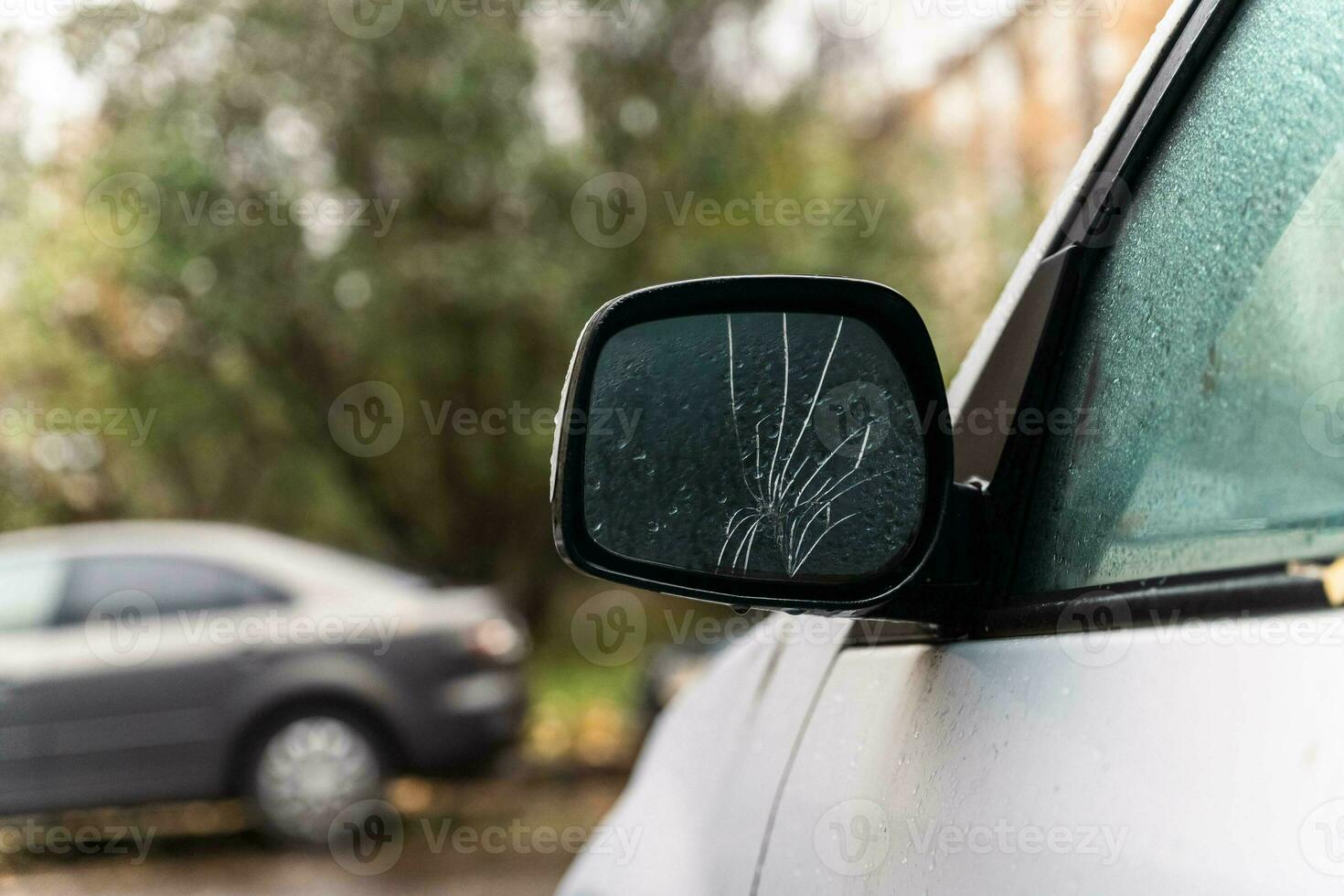 Damaged Exterior Rearview Mirror of a Car - Vehicle Maintenance Problem Concept photo