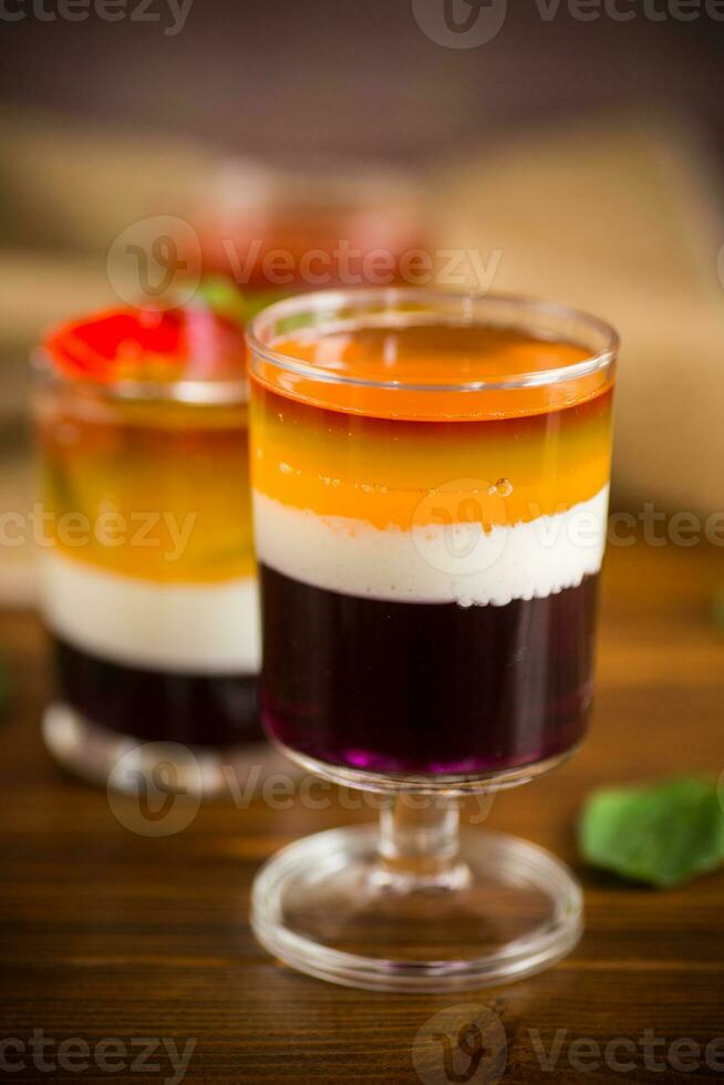 lot of colored sweet fruit jelly in a glass photo