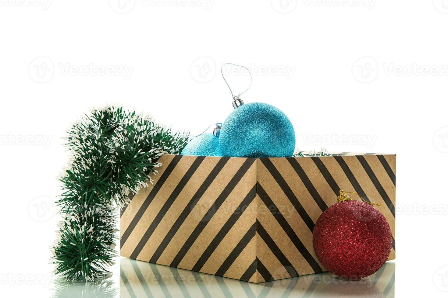 Christmas card . New Year's colorful toys in a box with decorations. photo