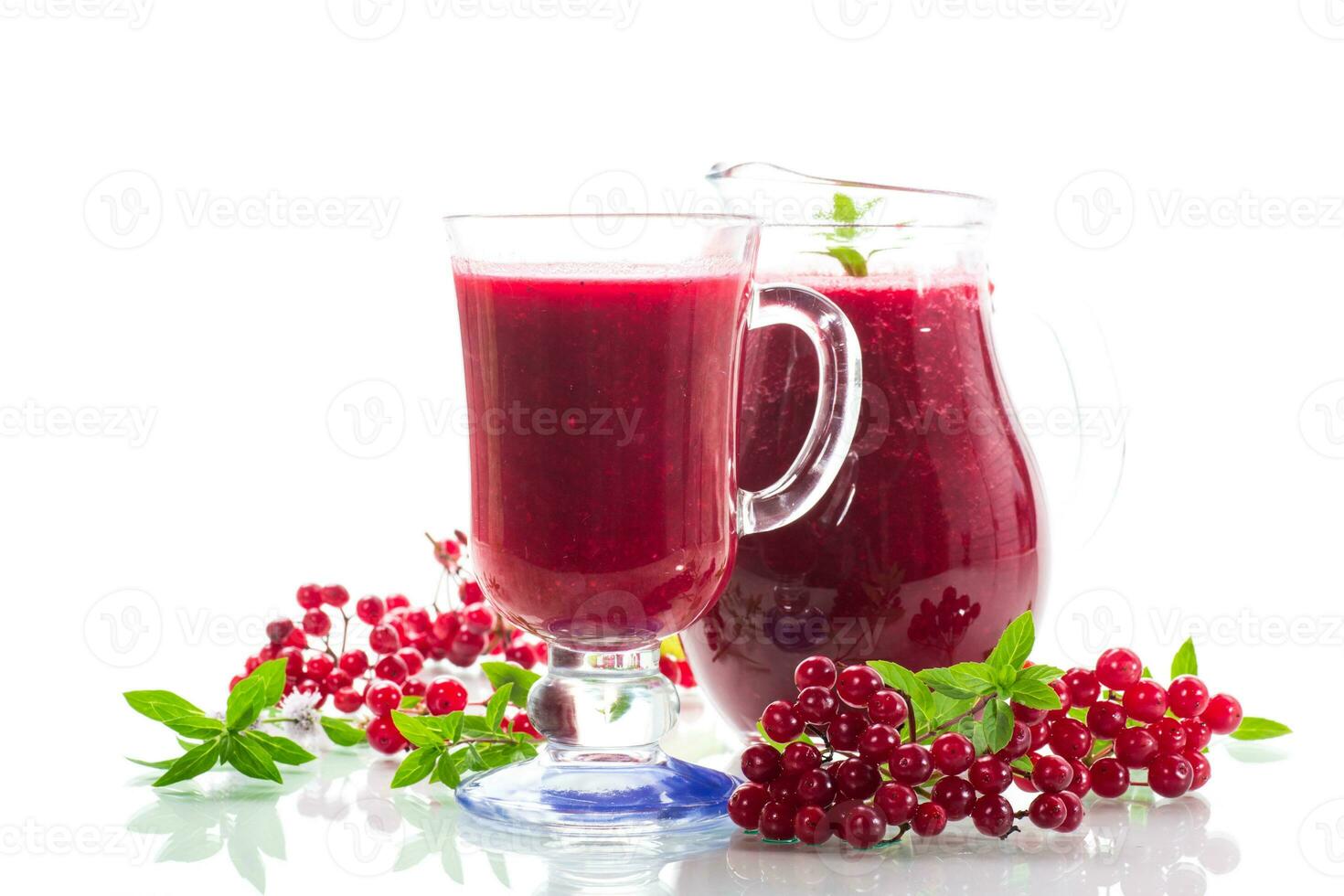 freshly squeezed thick natural juice with pulp from ripe red viburnum in a decanter photo