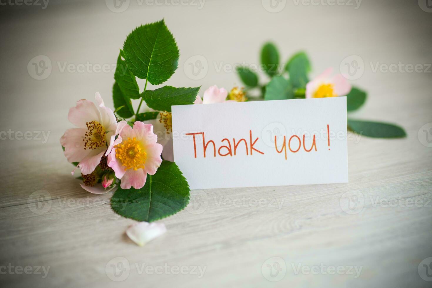 beautiful pink small roses on a wooden table. photo