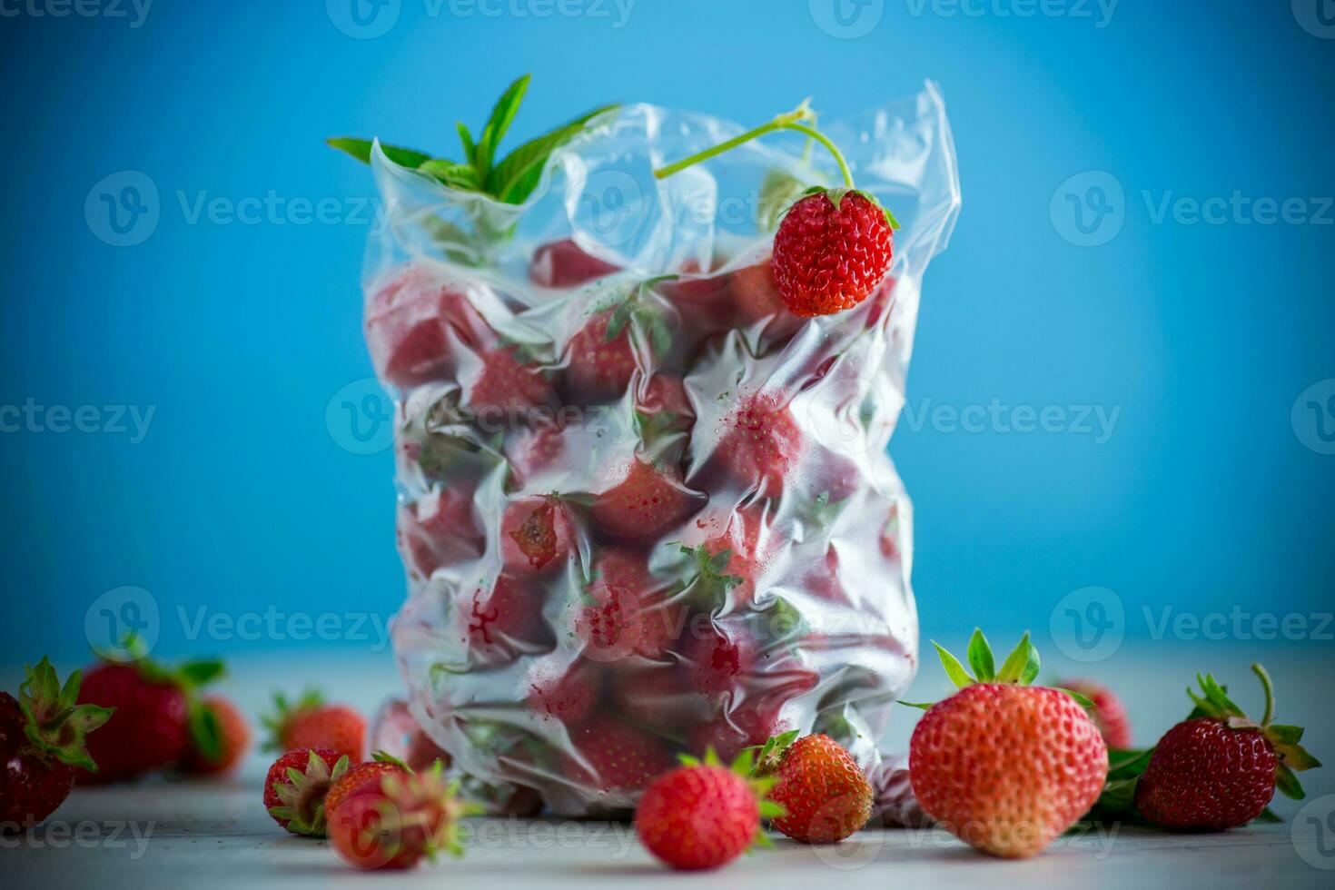 frozen fresh strawberries in a vacuum bag photo