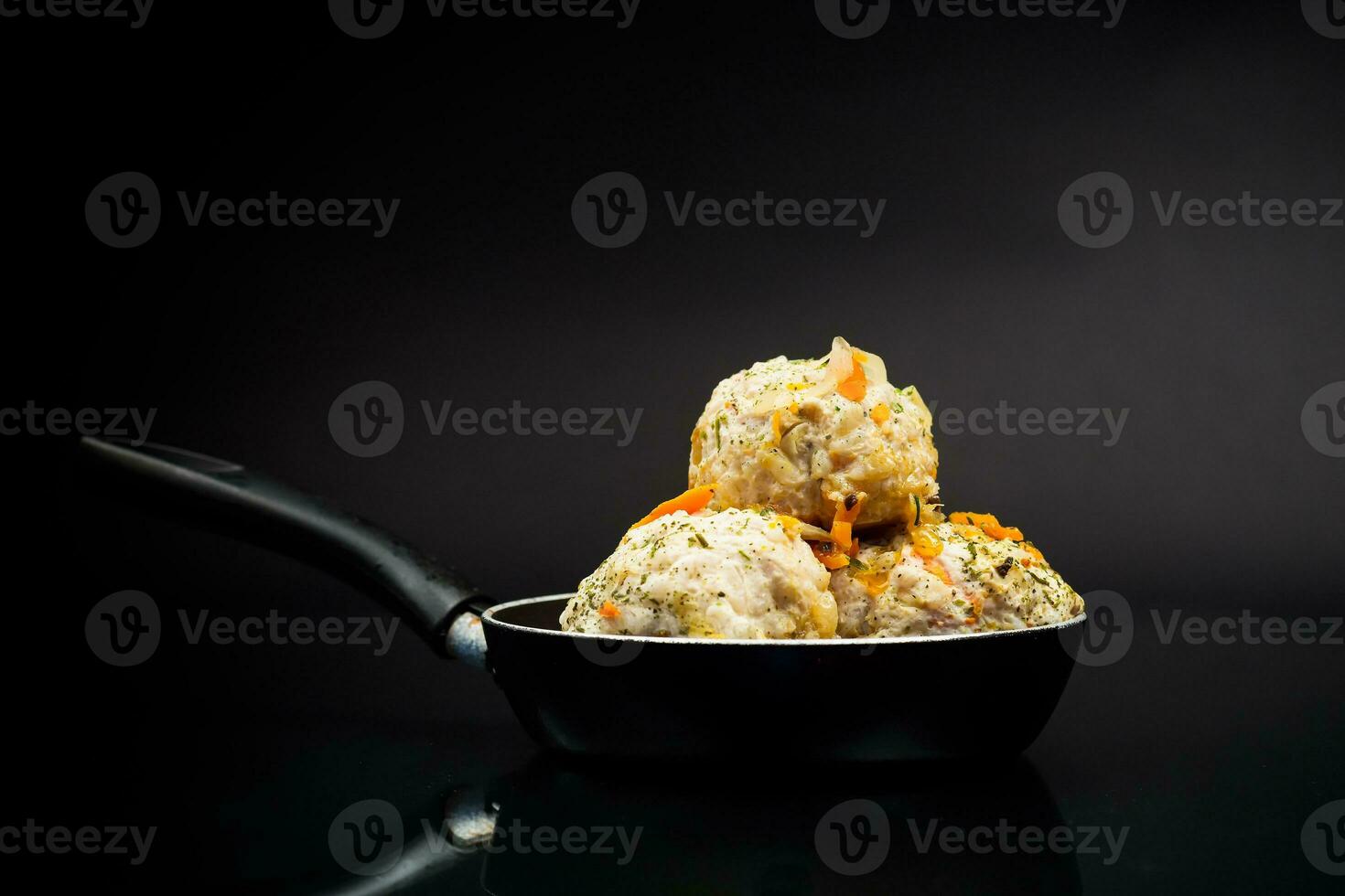 cooked chicken diet meatballs in a frying pan photo