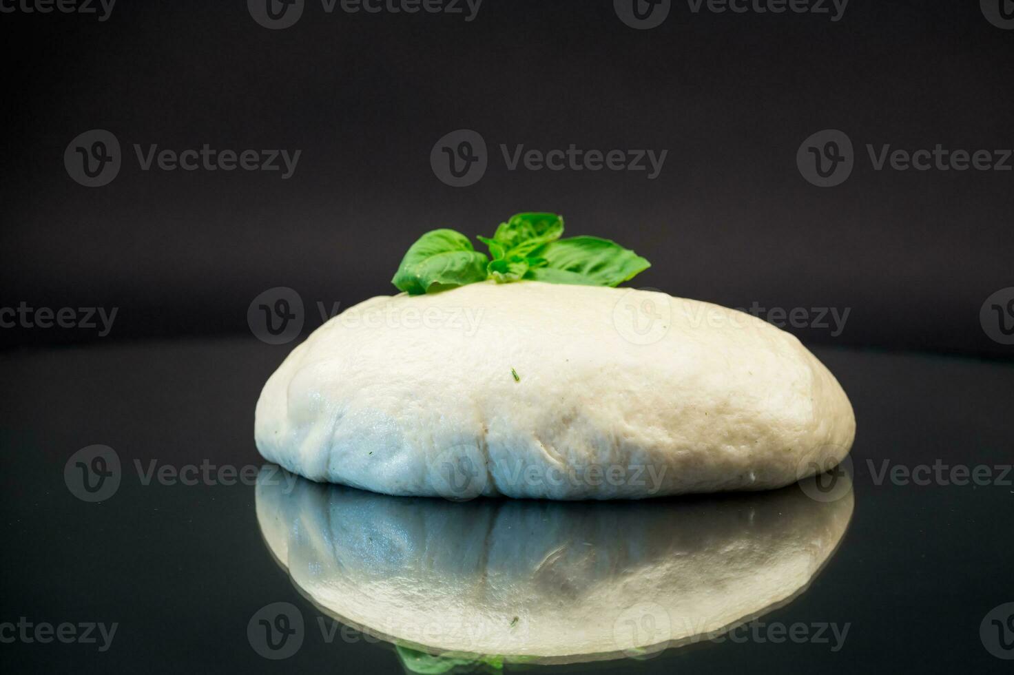 homemade yeast soft dough on black background photo
