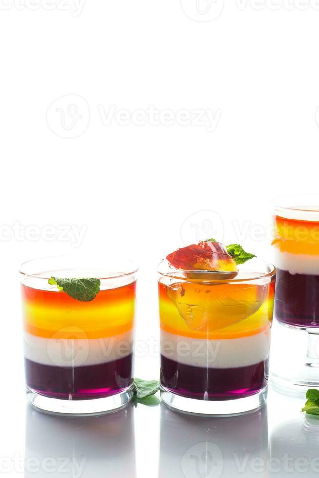 lot of colored sweet fruit jelly in a glass photo