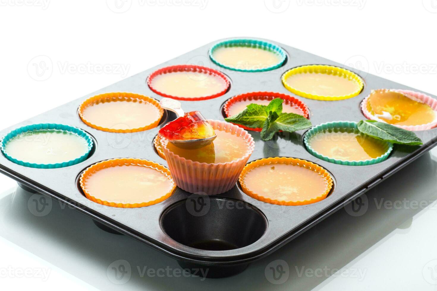 lot of colored sweet fruit jelly in a glass photo