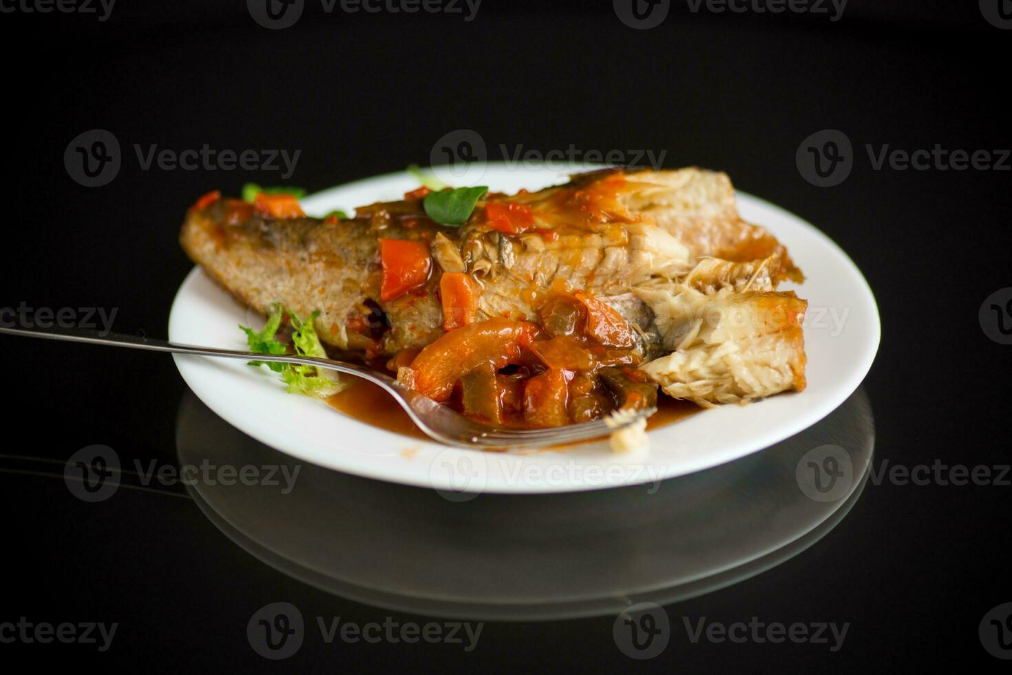 whole fish hake stewed with carrots, beets, peppers and other photo