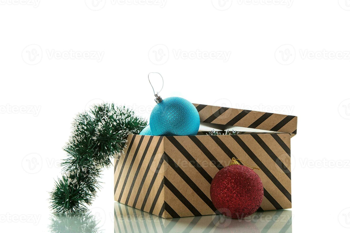 Christmas card . New Year's colorful toys in a box with decorations. photo