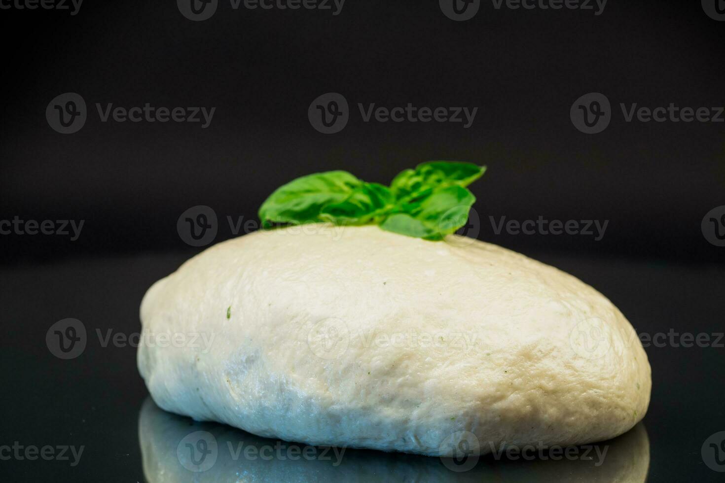 homemade yeast soft dough on black background photo
