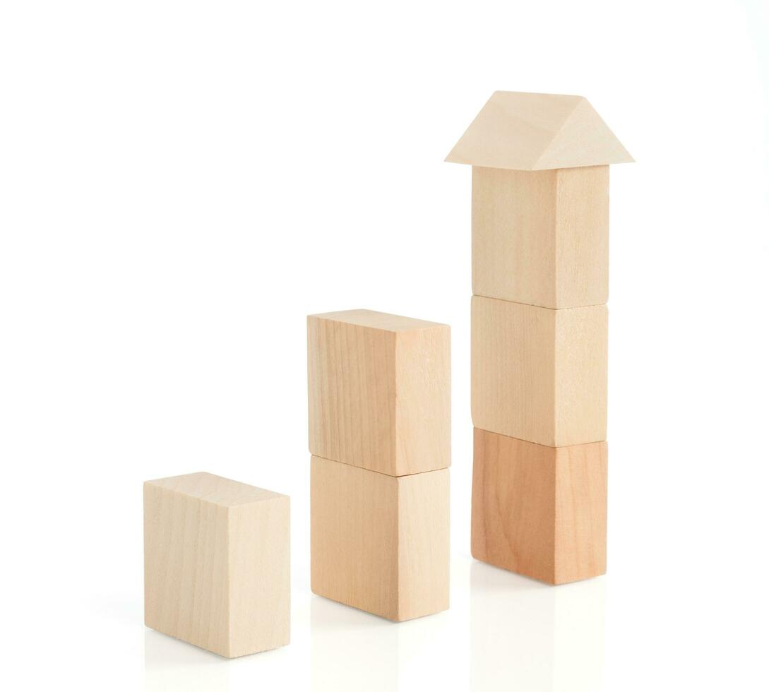 Business concept growth success process, statistics graph. Wooden blocks stacking as an arrow up averages as a growth graph chart on white background. photo