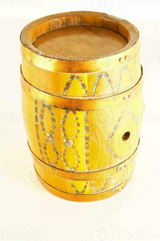 a wooden barrel with a gold design on it photo