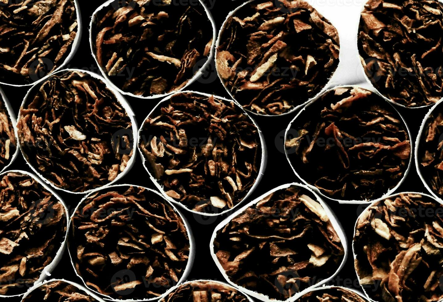 Tobacco Industry with stacked cigarettes photo