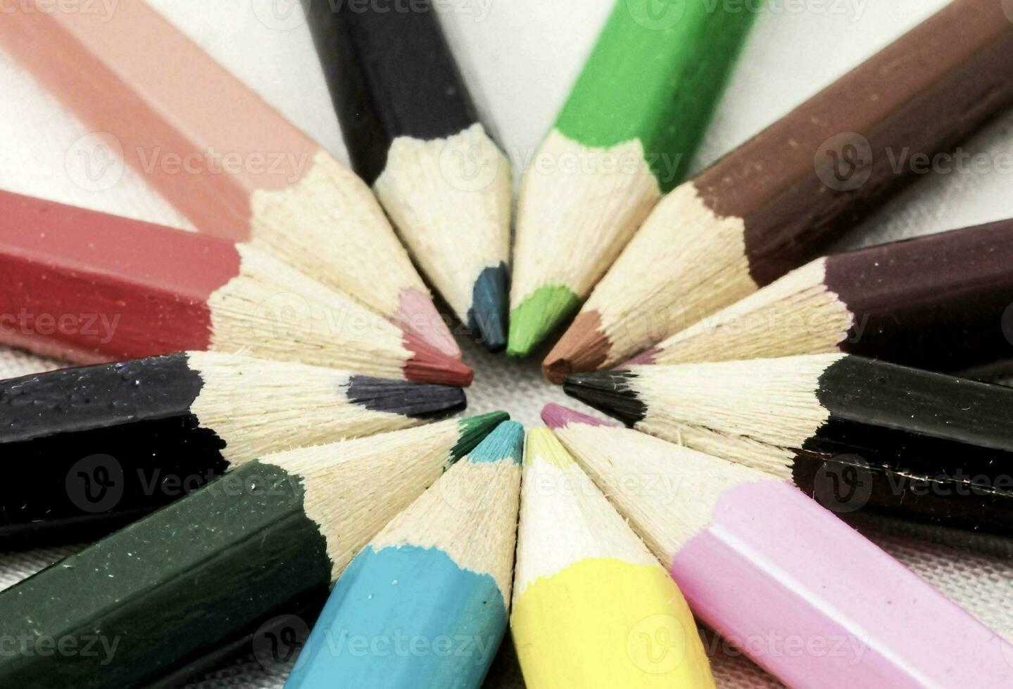 a close up of several colored pencils photo