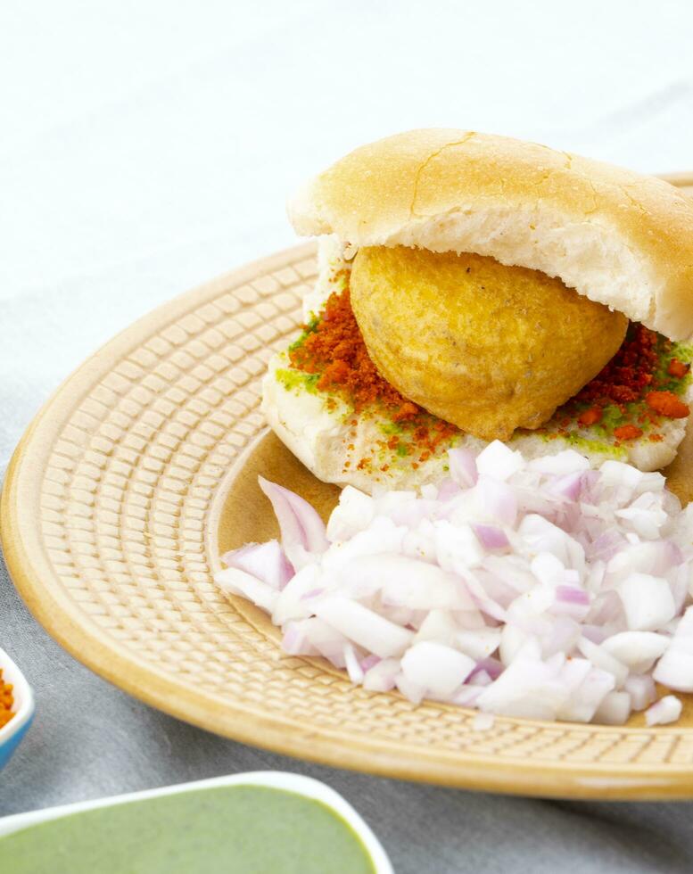 Indian Famous Street Food Vada Pav is a Vegetarian Fast Food Dish From Maharashtra photo
