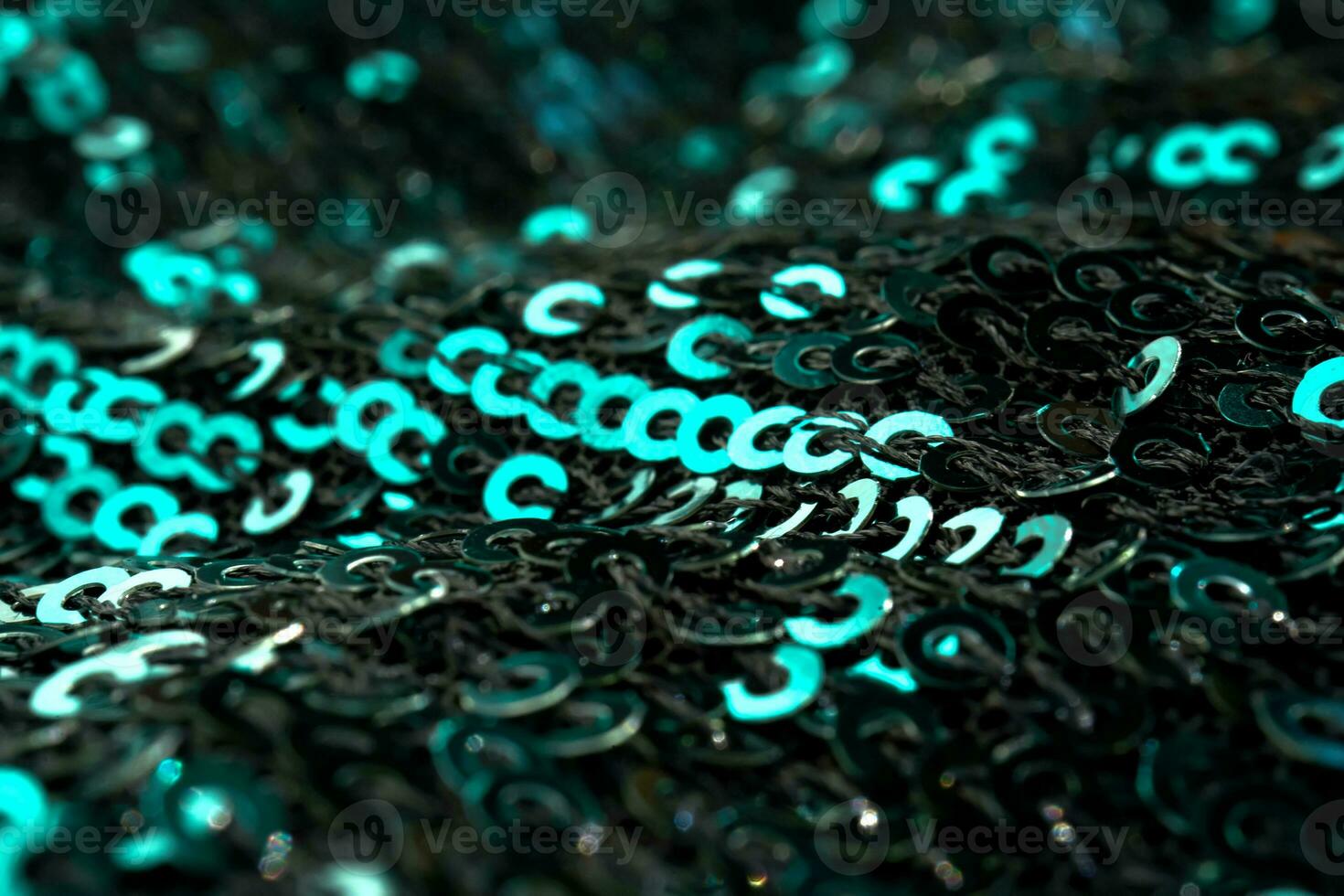 Christmas abstract background made of emerald green sequins. photo