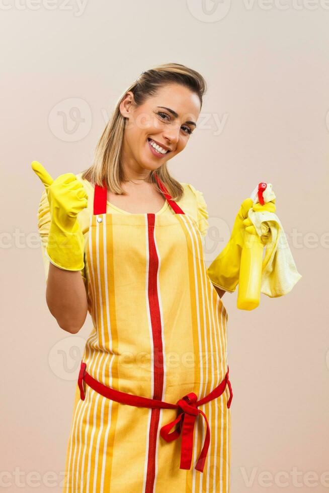 Portrait of happy housewife showing thumb up photo