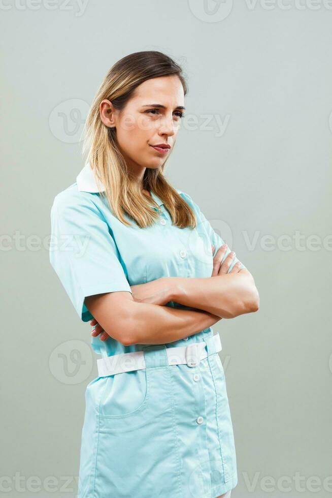 Angry nurse thinking about something. photo