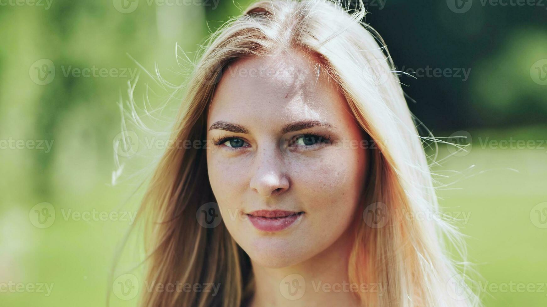 The face of a young Slavic girl blonde closeup. photo