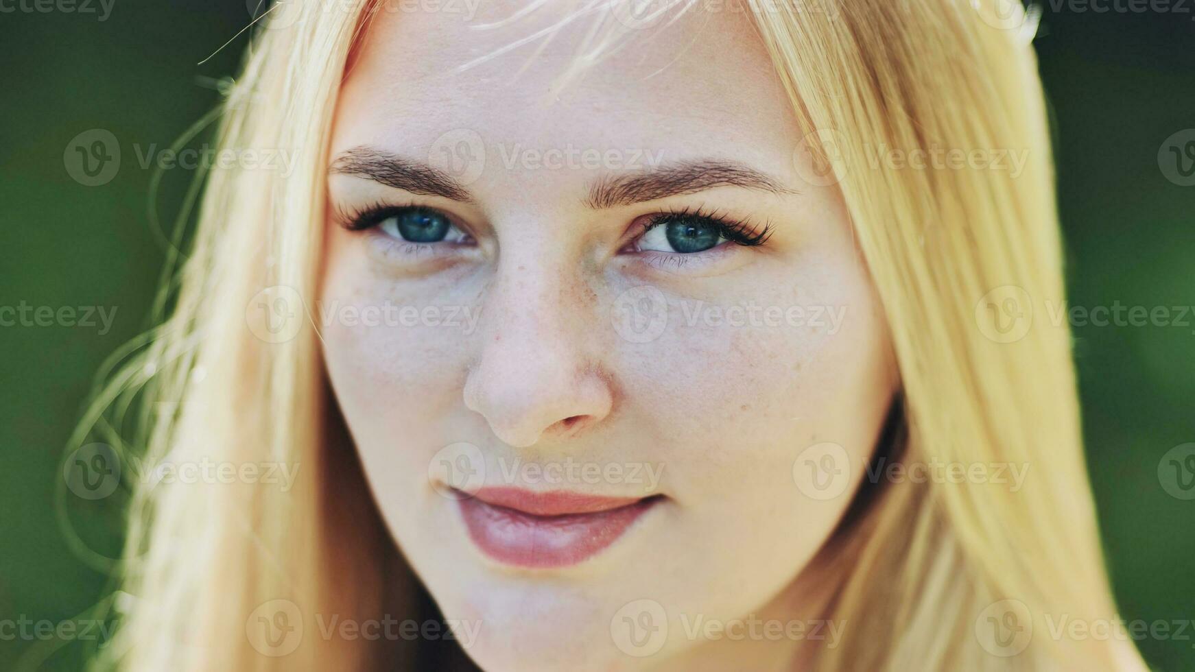 The face of a young Slavic girl blonde closeup. photo