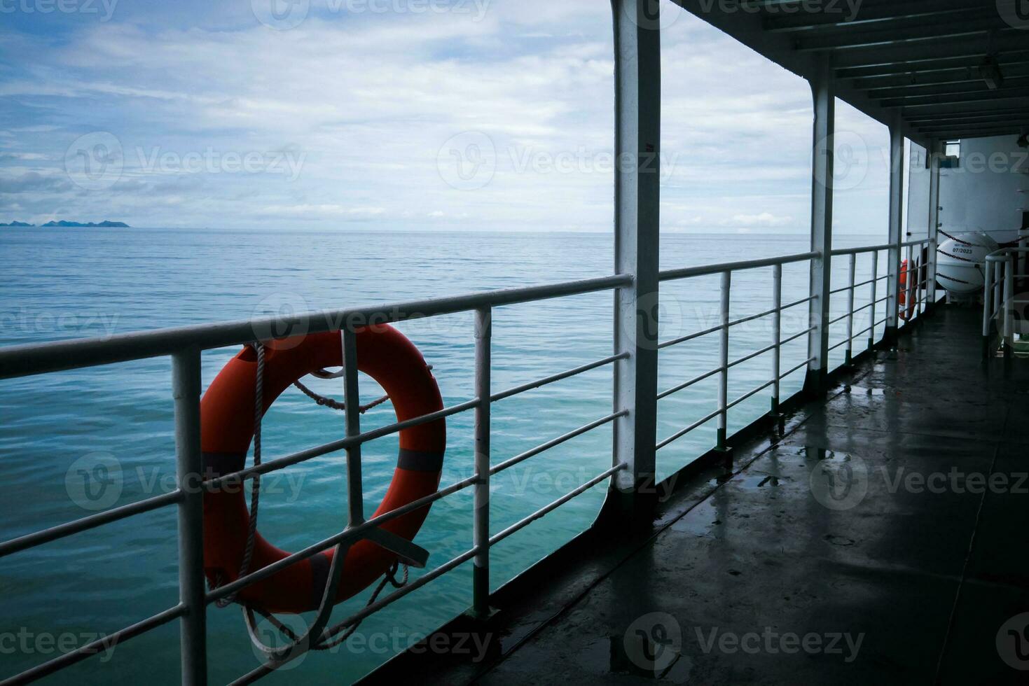 Lifebuoy attached to the side of the boat Ready to use in an emergency. Maritime safety concept photo