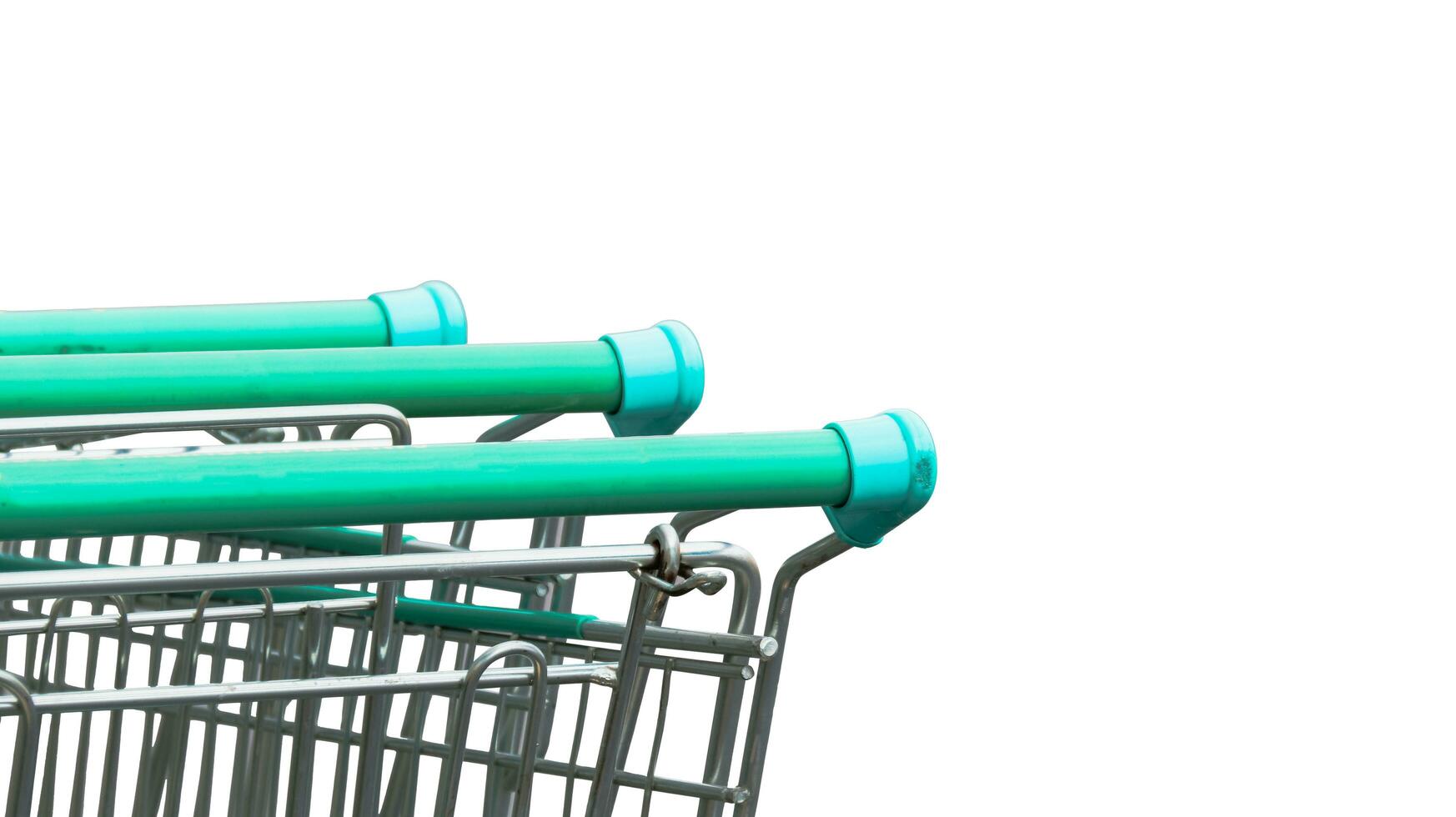 Close up view of shopping cart handles on white background photo