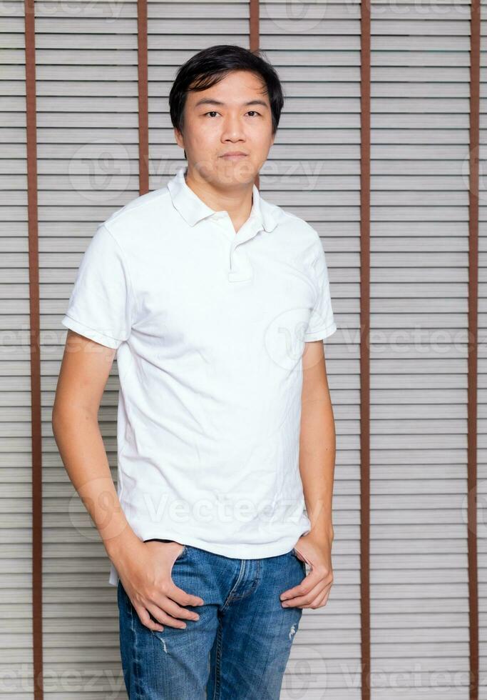 Portrait of a man Asian standing in black t-shirt and shorts. Isolated  on background with copy space and clipping path photo