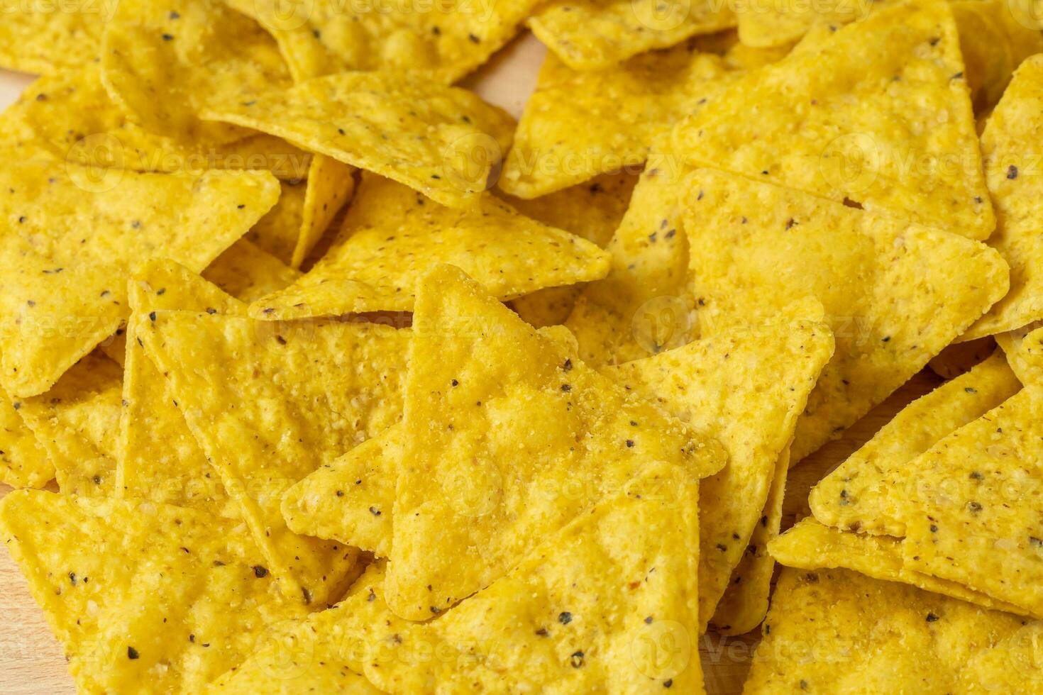 Mexican nachos chips on the wooden board photo