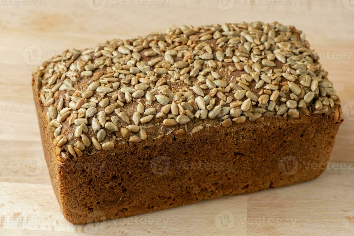 Bread with sunflower seeds. Delicious and healthy home-made wholegrain bread photo