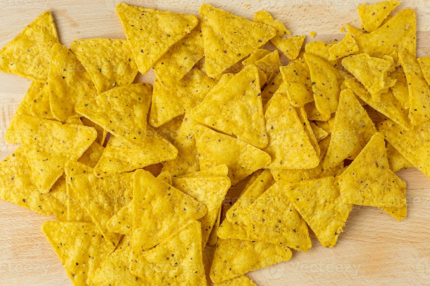 Mexican nachos chips on the wooden board photo