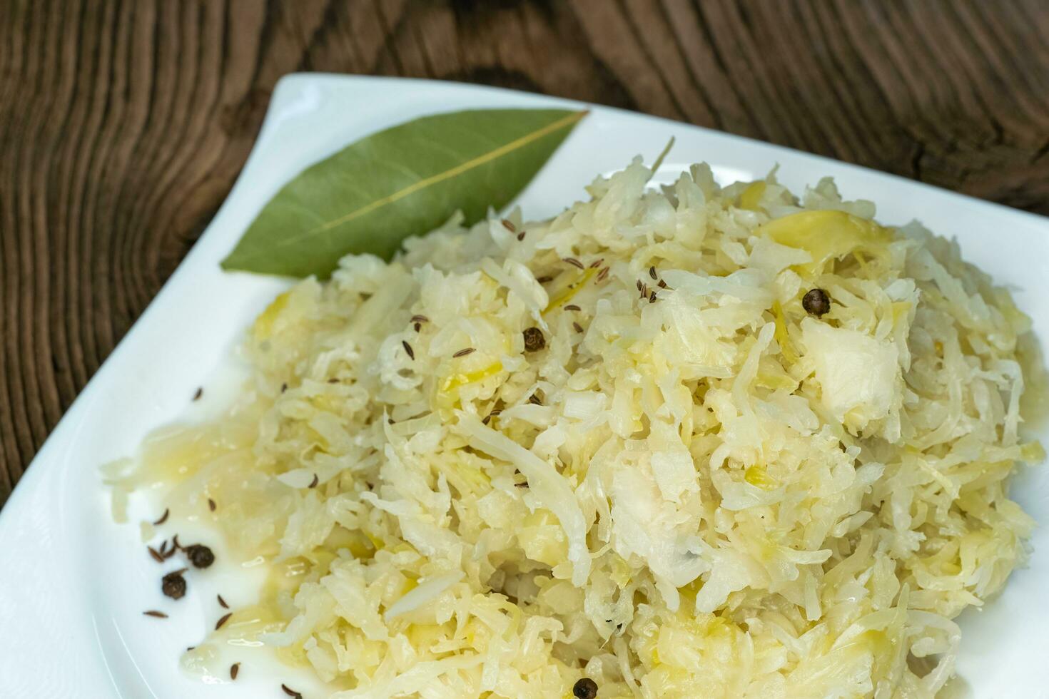 Homemade pickled sauerkraut on a white plate photo