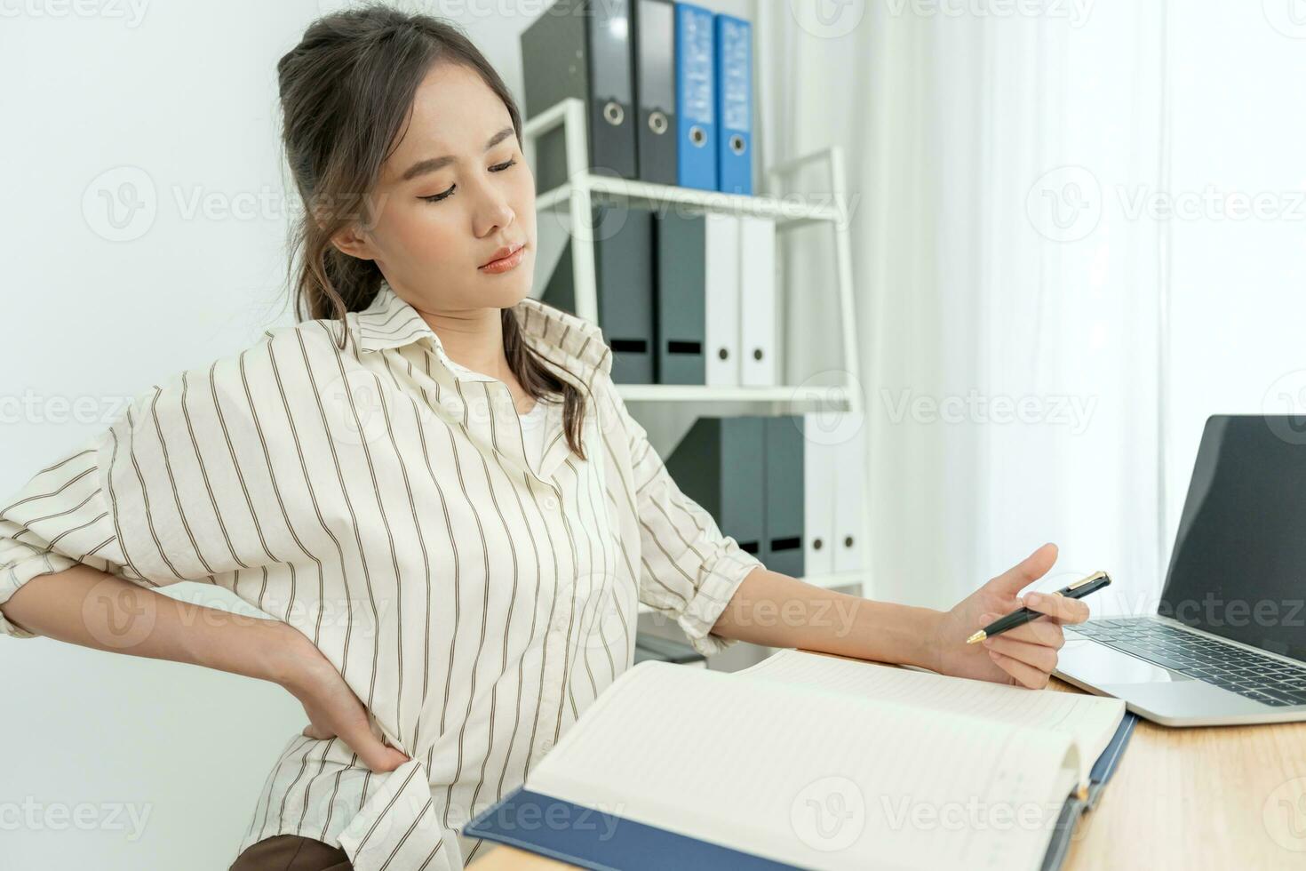 Suffering from scoliosis osteochondrosis after long study pretty young  Asian woman feel hurt joint back pain laptop in incorrect posture sit on  chair Stock Photo - Alamy